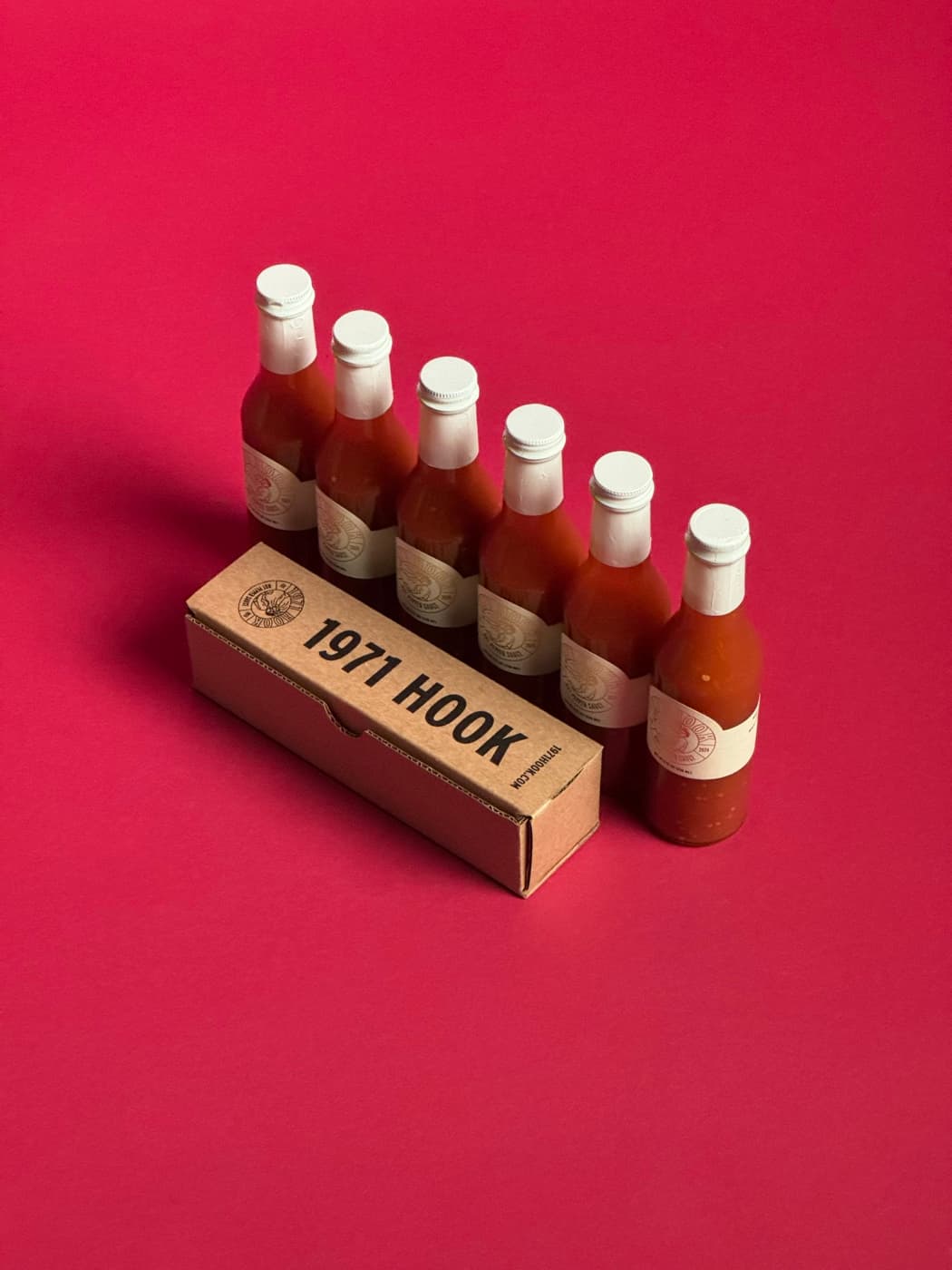 1971 Hook bottles and box on red