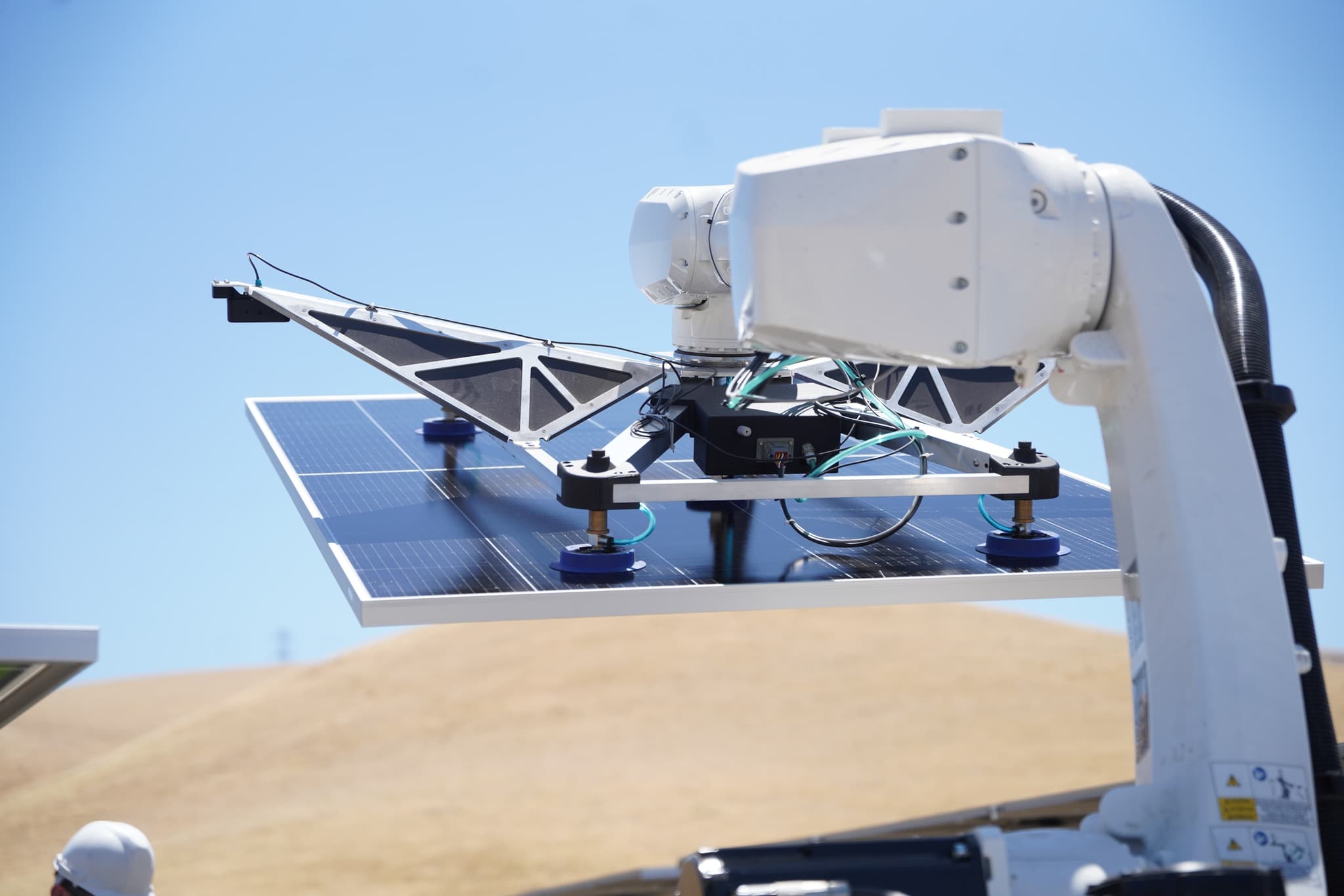 Robot arm placing a solar panel, Patterson